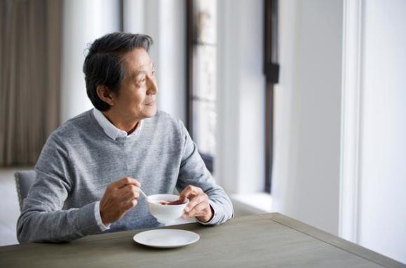 Elderly Asian Man Eating Getty Images